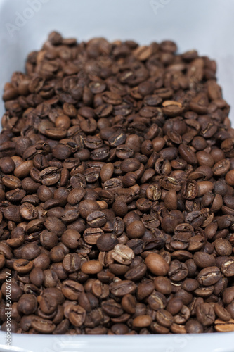 Perspective view of medium roasted coffee beans. Coffee shop. Freshly roasted coffee beans.