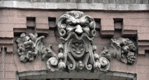 Building facade decor with human face
