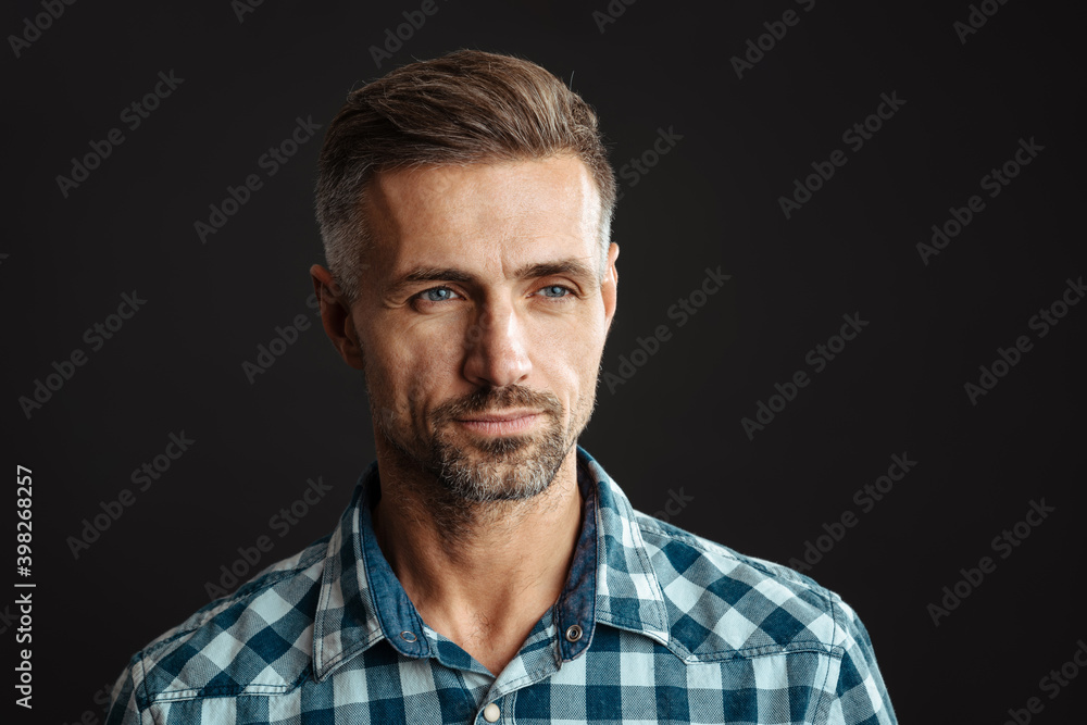 Serious grey-haired man posing isolated