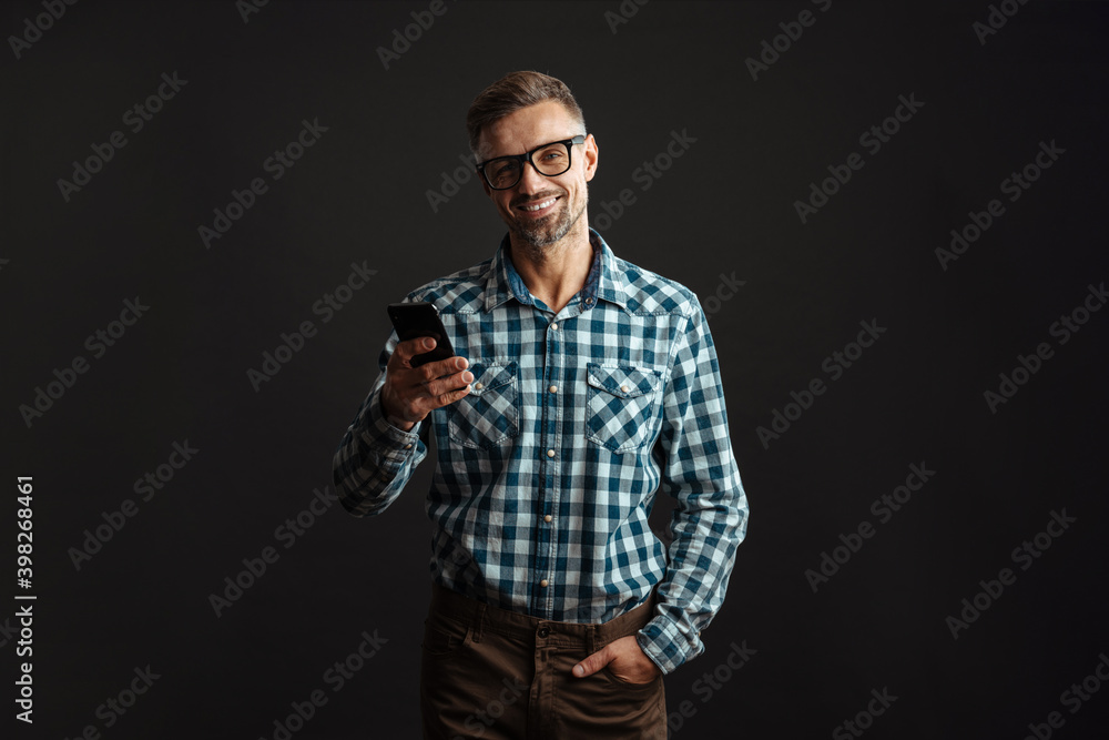 Grey-haired man using mobile phone isolated Grey-haired man using mobile phone isolated