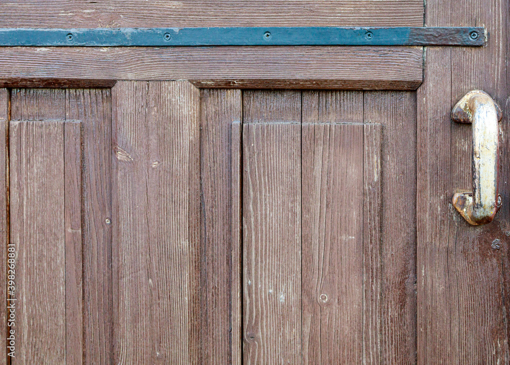 old brown wooden door close up old brown wooden door close up