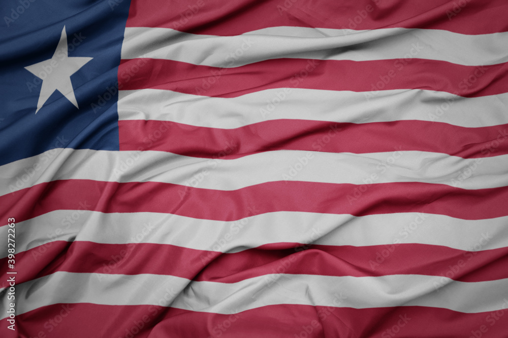 Obraz premium waving colorful national flag of liberia.