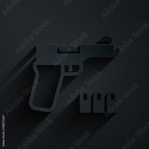 Paper cut Pistol or gun icon isolated on black background. Police or military handgun. Small firearm. Paper art style. Vector.