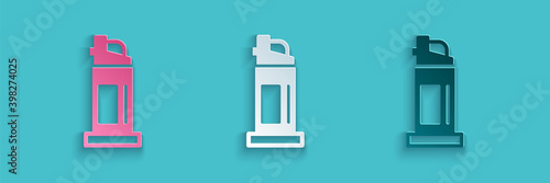 Paper cut Pepper spray icon isolated on blue background. OC gas. Capsicum self defense aerosol. Paper art style. Vector.