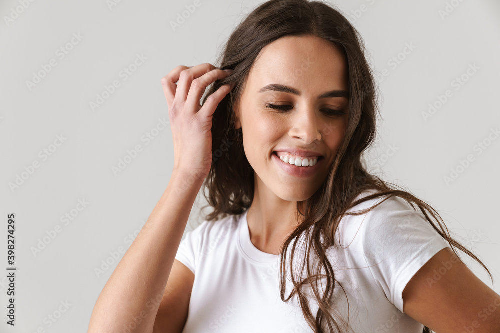 Fototapeta premium Happy beautiful girl posing and smiling at camera