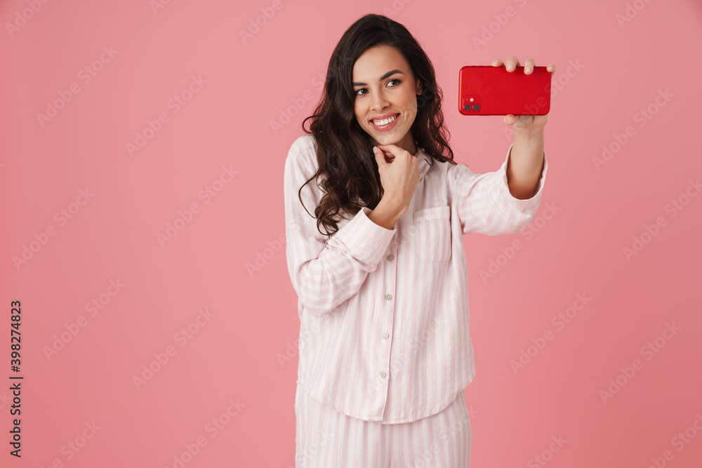 Cheerful beautiful woman taking selfie on mobile phone Cheerful beautiful woman taking selfie on mobile phone