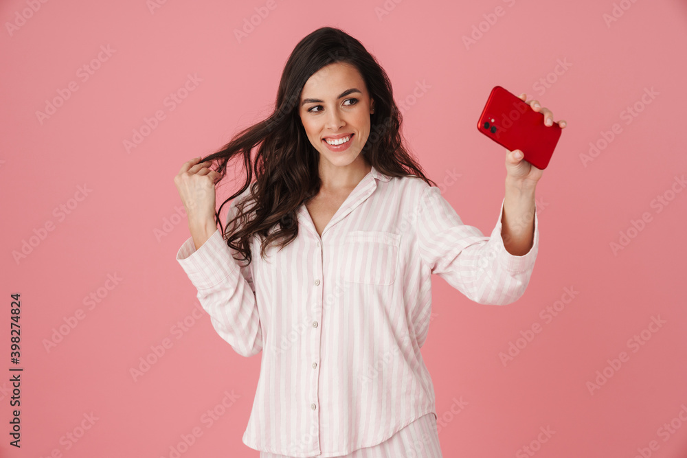Cheerful beautiful woman taking selfie on mobile phone Cheerful beautiful woman taking selfie on mobile phone