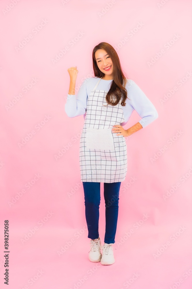 Portrait beautiful young asian woman in kitchen wear with apron Portrait beautiful young asian woman in kitchen wear with apron