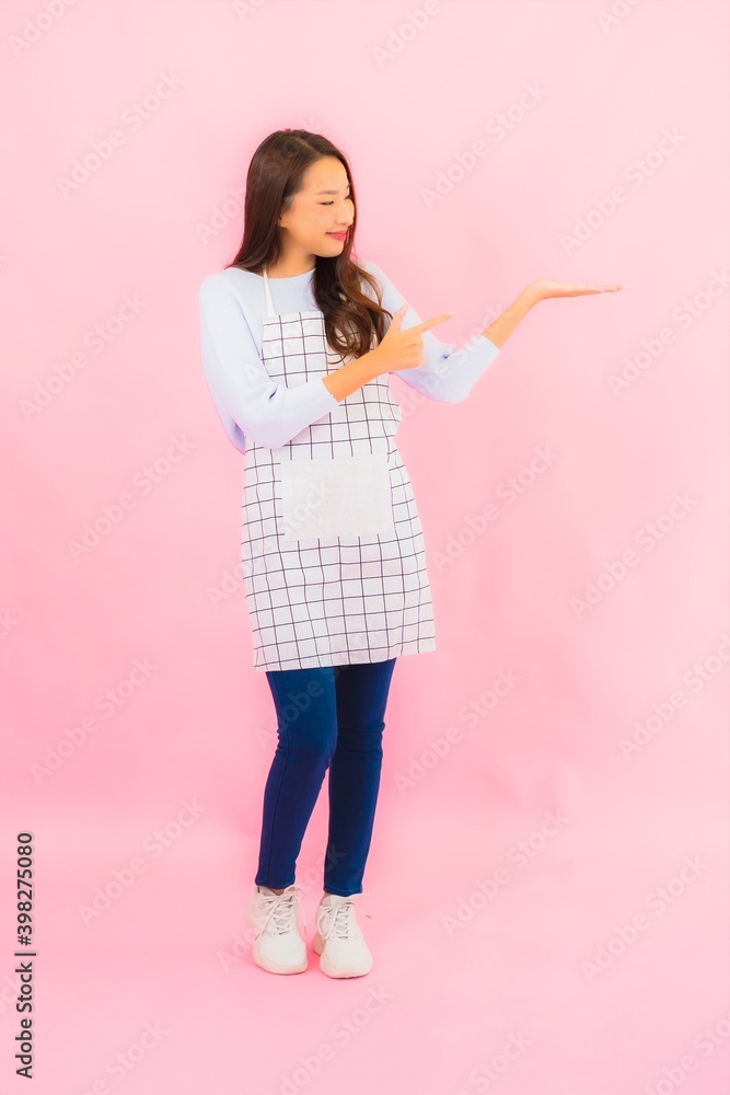 Portrait beautiful young asian woman in kitchen wear with apron Portrait beautiful young asian woman in kitchen wear with apron