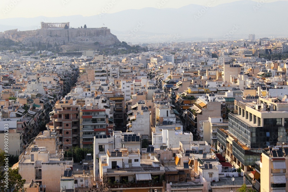 Partial view of Athens city with Acropolis hill in the background - Athens, Greece, June 13 2019.
