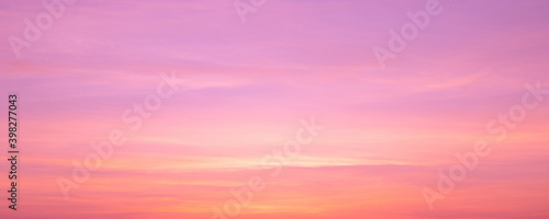 Panorama of twilight pink sky in soft clouds in the sunset with pastel background and backdrop