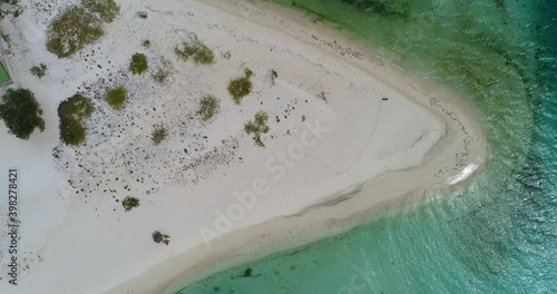 Los roques Venezuela.  aerial cenital view pan left  upward movement tropical beach blue water madrisqui island photo