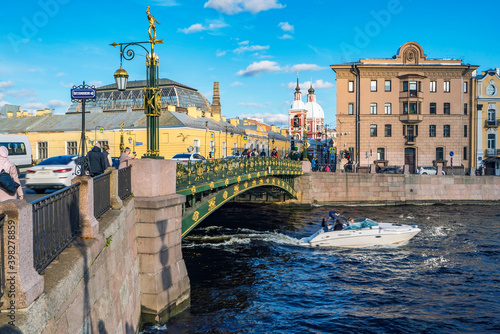 Saint-Petersburg. Fontanka river with a floating tourist boat . Panteleimon bridge. Russia. photo