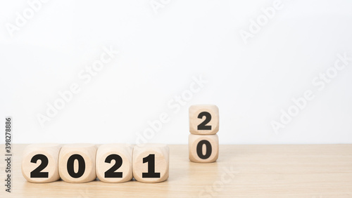 Message Year 2020 replaced by 2021 written on beach sand background. Good bye 2020 hello to 2021 happy New Year coming concept