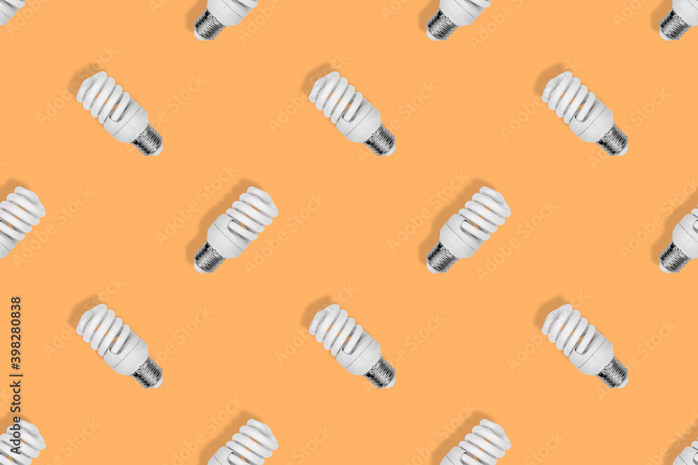 Lighting lamps seamless pattern. Background on the theme of light bulbs. Lighting lamps seamless pattern. Background on the theme of light bulbs.
