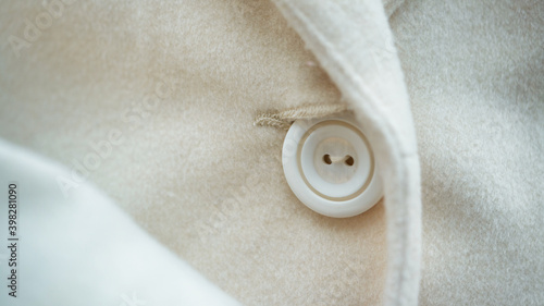 button coat white on white