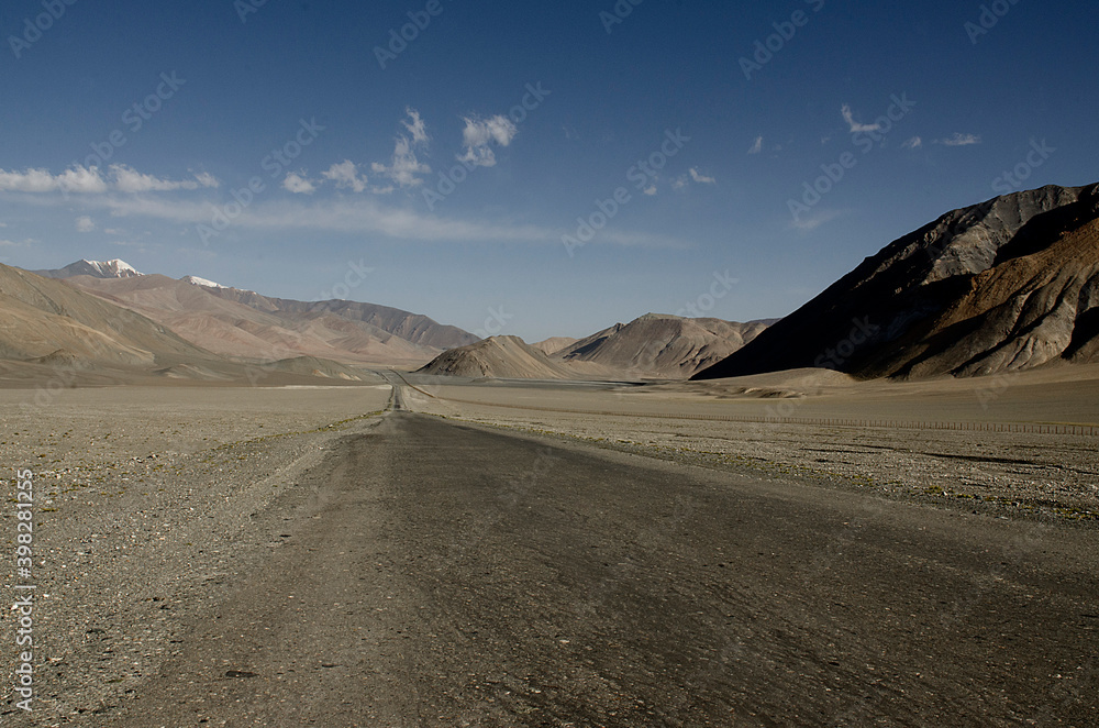 View of a road on a desertic plateau. Pamir highway