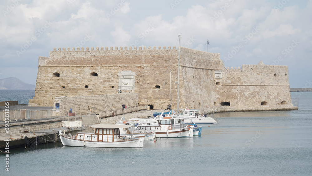 The harbour of Heraklion City on Crete Island with yachts and boats in Greece.