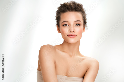 Beautiful woman with perfect makeup on white background. Beauty and skin care concept photo