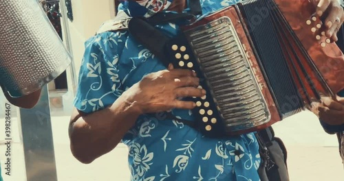 Merengue Music - Group Of Men Playing Tambora, Metal Guiro And Accordion In The Street Of Dominican Republic. - close up