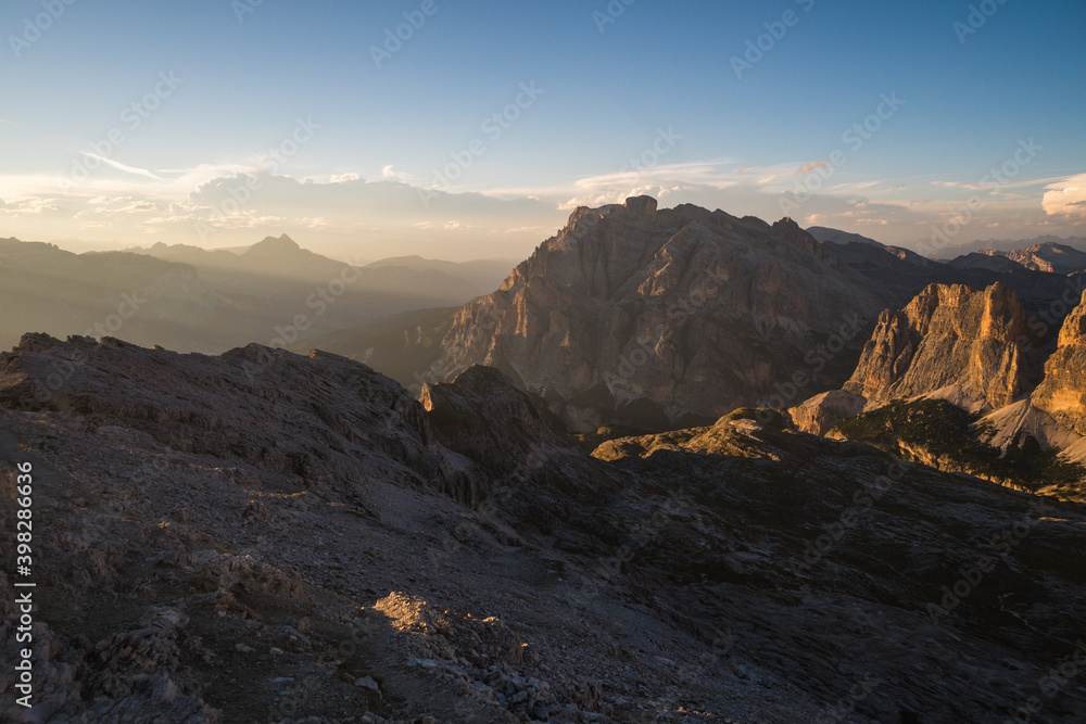 Beautiful scenic views of rocks and shadows at sunset in the Dolomites. Gorgeous stunning mountains in the golden hour. Italy