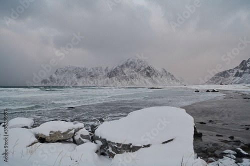 norway coast in winter with snow bad cloudy weather