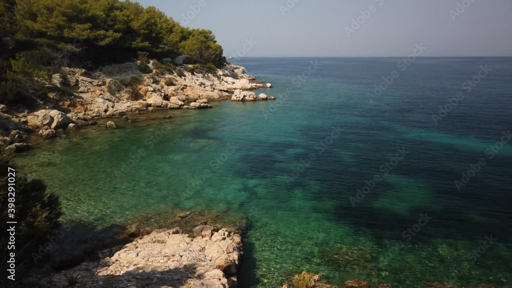 Panning view of clear waters and amazing blue waters of Svitnja beach on the island of Vis in Croatia Panning view of clear waters and amazing blue waters of Svitnja beach on the island of Vis in Croatia