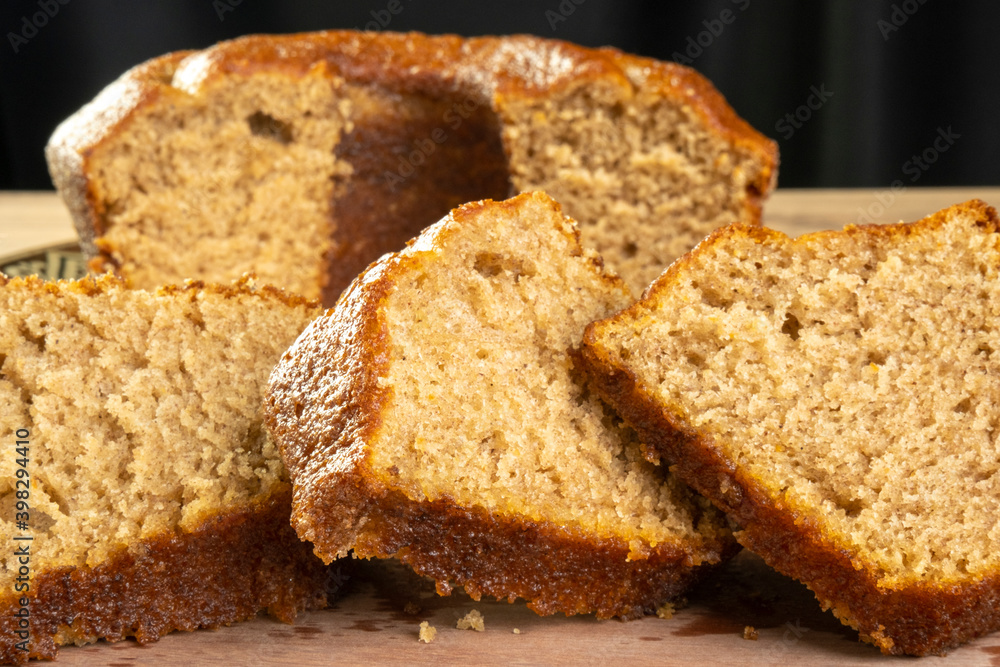 some slices of a banana cake on wooden table some slices of a banana cake on wooden table
