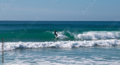 Young surfer riding perfect surf wave at the beach of El Palmar. Spanish Atlantic coast in Cadiz  perfect surfing spot in Europe