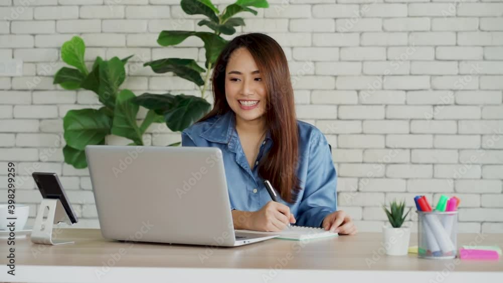 Asian business woman work from home with computer notebook laptop telemarketing. new normal concept. Asian business woman work from home with computer notebook laptop telemarketing. new normal concept.