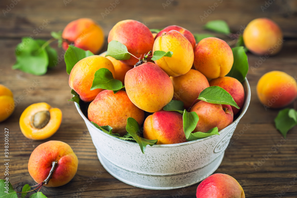 Fresh and ripe organic apricots on the wooden table
Fresh and ripe organic apricots on the wooden table