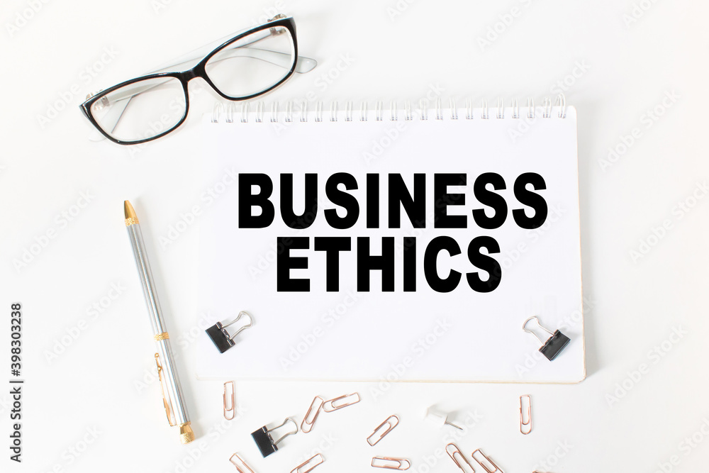 Notepad with inscriptions BUSINESS ETHICS on a white background. business concept. Notepad with inscriptions BUSINESS ETHICS on a white background. business concept.