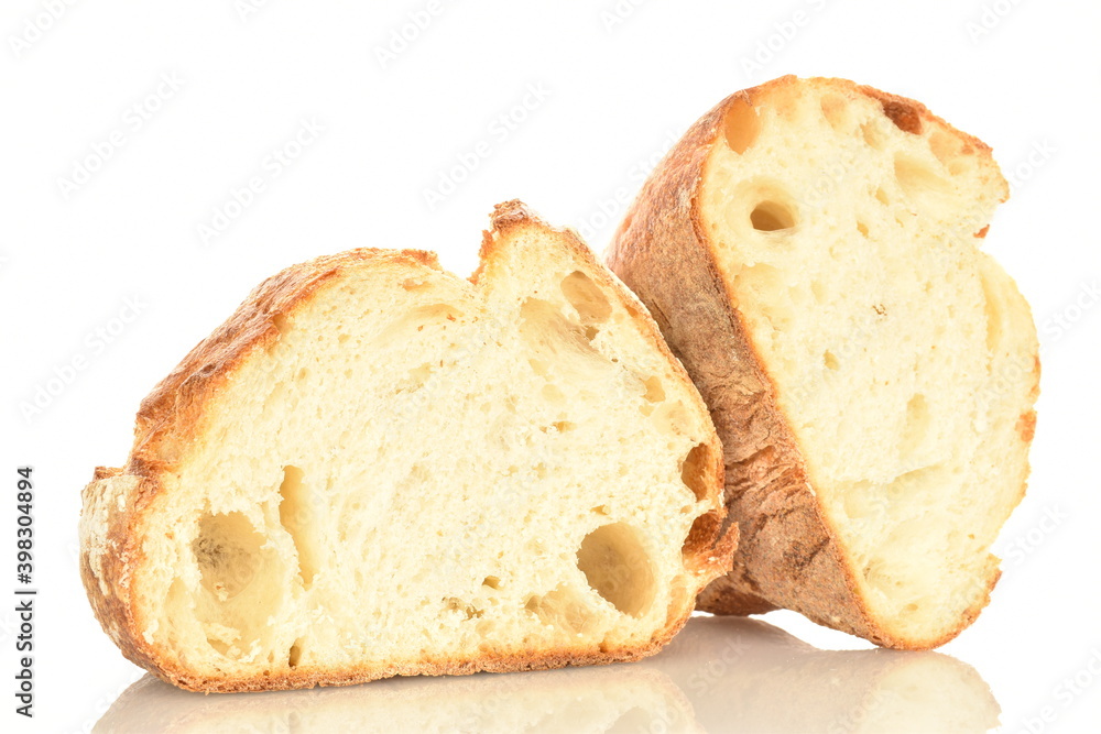 Fragrant French hearth bread, close-up, isolated on white.