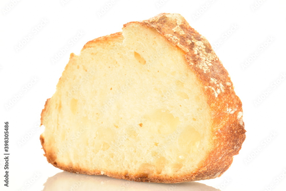 Fragrant French hearth bread sliced into slices, close-up, isolated on white.