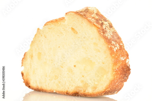 Fragrant French hearth bread sliced into slices, close-up, isolated on white.