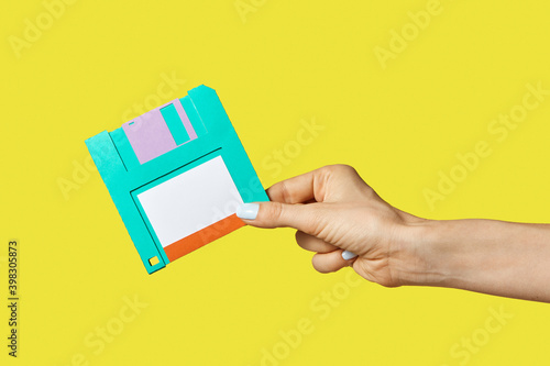 Paper craft diskette in the hand.