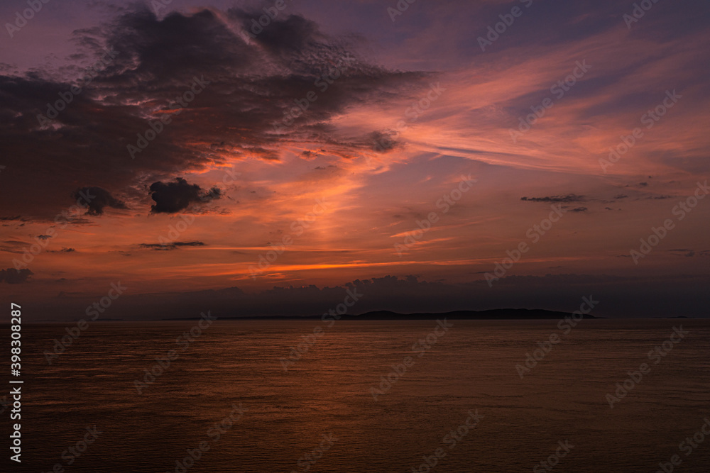 Summer sunrise at Murlough Bay County Antrim looking over to The Mull of Kintyre in Scotland across the North Channel in the Irish Sea, Ballycastle, County Antrim, Causeway coast and glens, Northern I