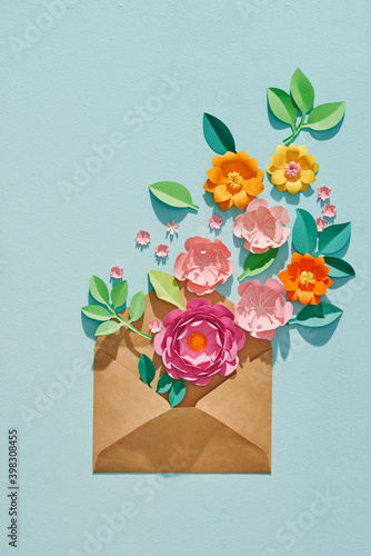 8 March. Opened brown envelope full of varios colorful paper flowers.