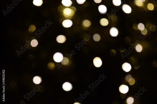 Lights blurred bokeh abstract on dark background, rozmyte światełka na ciemnym tle lampki świąteczne photo