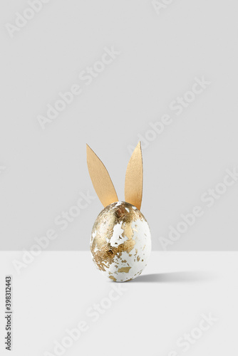Golden Easter egg with Banny ears. photo