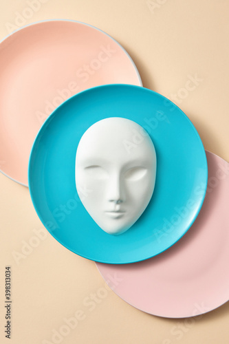 Plaster face mask on a plate. photo