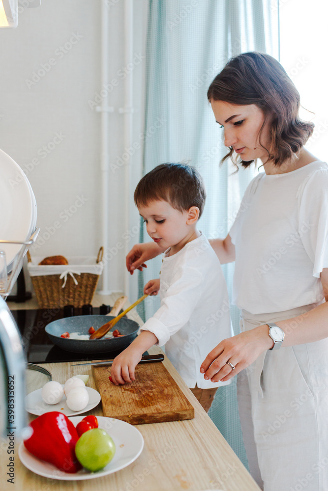 Mother and son cooking breakfast together Mother and son cooking breakfast together