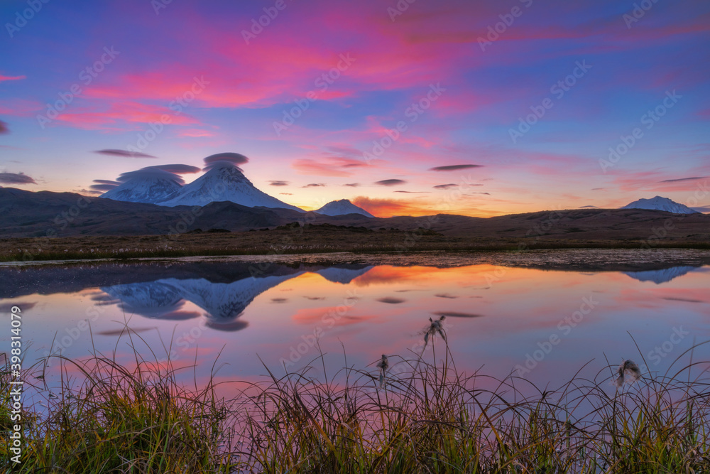 Sunset with volcanoes mountains with clouds on Kamchatka Peninsula. Sunset with volcanoes mountains with clouds on Kamchatka Peninsula.