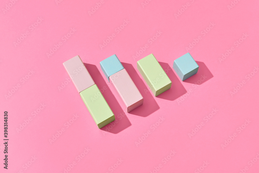 © Yaroslav Danylchenko/Stocksy - Wooden blocks as a vertical bar chart.