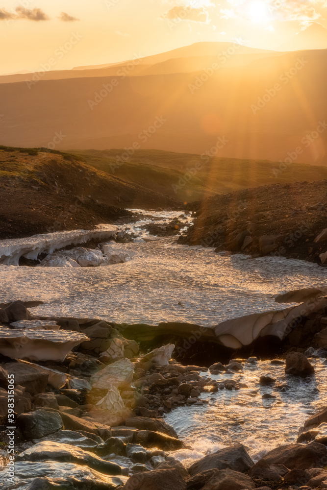 Bright sunset landscape above Mutnovsky volcano, Kamchatka Peninsula. Bright sunset landscape above Mutnovsky volcano, Kamchatka Peninsula.