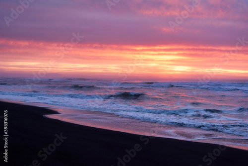 Pretty sunrise landscape on Khalaktyrsky Beach Kamchatka Peninsula, Russia. photo