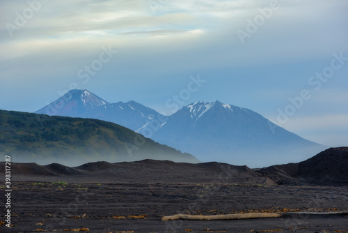 Mountain landscape with black sand of Khalaktyrsky Beach Kamchatka Peninsula, Russia. photo