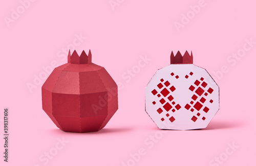 Handmade pomegranate fruit from paper. photo