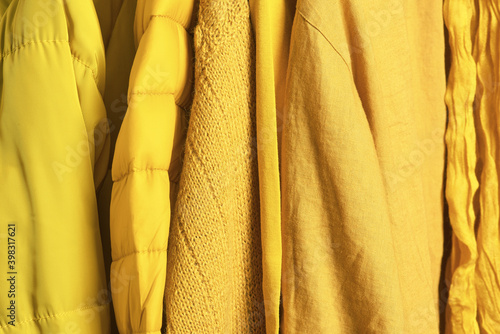 Set of trendy yellow clothes, illuminating color, color of the 2021 photo