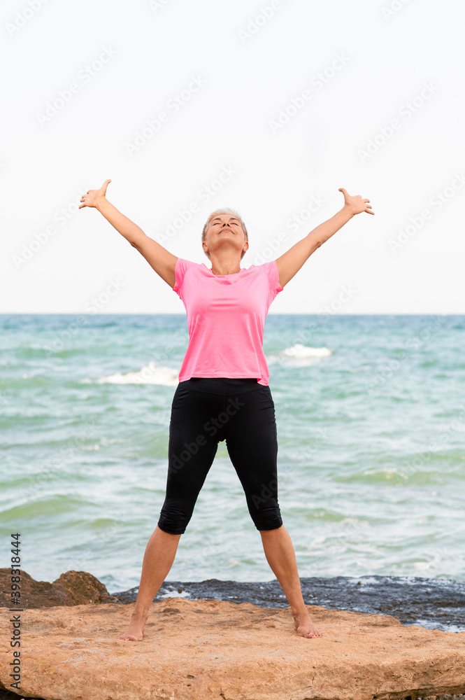 Vertical portrait of woman stretching outdoor Vertical portrait of woman stretching outdoor